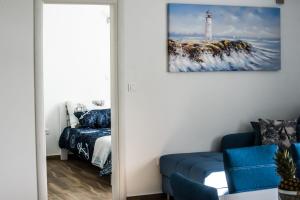 Posteľ alebo postele v izbe v ubytovaní Blue Pearl apartment