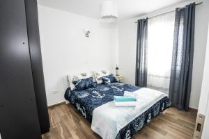 Posteľ alebo postele v izbe v ubytovaní Blue Pearl apartment