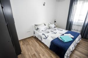 Posteľ alebo postele v izbe v ubytovaní Blue Pearl apartment