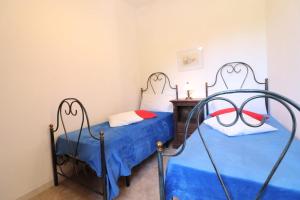 A bed or beds in a room at Masseria Fagà