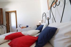 A bed or beds in a room at Masseria Fagà