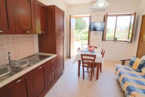 A kitchen or kitchenette at Masseria Fagà