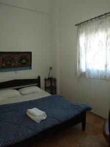 Postel nebo postele na pokoji v ubytování Gialos Village