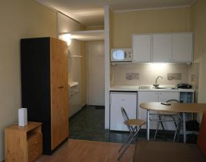 A kitchen or kitchenette at Royal Studio Apartment Még 4 kép