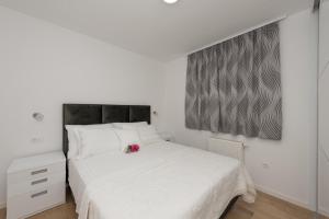 Postel nebo postele na pokoji v ubytování Penthouse Jure