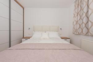 Postel nebo postele na pokoji v ubytování Penthouse Jure