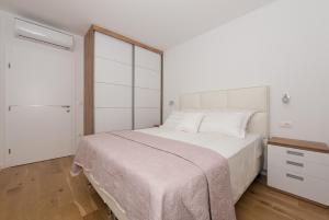 Postel nebo postele na pokoji v ubytování Penthouse Jure