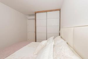 Postel nebo postele na pokoji v ubytování Penthouse Jure