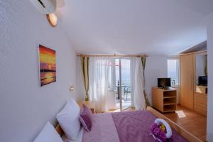 Postel nebo postele na pokoji v ubytování Pension Maric Rooms
