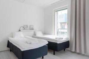 
Vuode tai vuoteita majoituspaikassa Hiisi Homes Espoo Center
