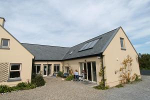 a house with a solar system on the roof at Atlantic Garden Lodge in Lisdoonvarna