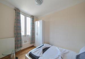 Postel nebo postele na pokoji v ubytování New Kent Apartments