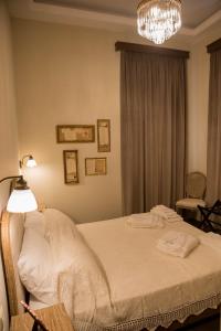 Łóżko lub łóżka w pokoju w obiekcie Kyria Boutique House