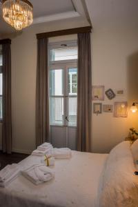 Łóżko lub łóżka w pokoju w obiekcie Kyria Boutique House