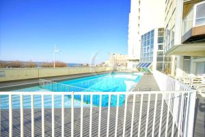 a swimming pool on the balcony of a building at Appartement bord de mer Biarritz in Biarritz