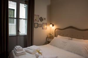 Łóżko lub łóżka w pokoju w obiekcie Kyria Boutique House