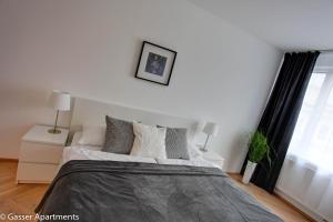 Cama o camas de una habitación en Gasser Apartments - Apartments Karlskirche
