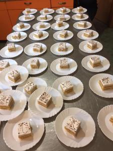 a table full of plates with cakes on them at Pansion Maglica in Međugorje