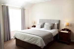 A bed or beds in a room at Kinderton House Hotel 