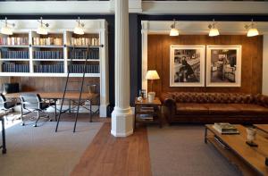 a living room with a couch and a table at Hotel Granvia in Barcelona