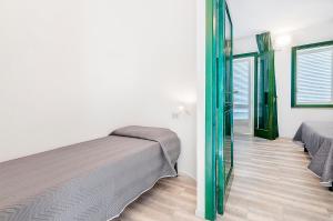 Voodi või voodid majutusasutuse Hotel Capo Di Stella toas
