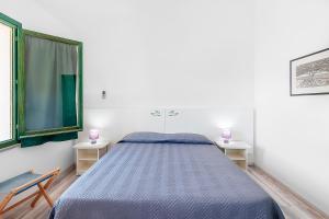 Voodi või voodid majutusasutuse Hotel Capo Di Stella toas