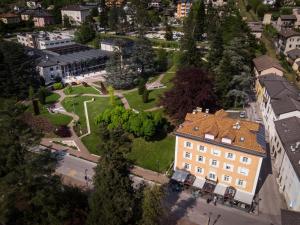 an aerial view of a building in a city at Hotel Terme Villa Regina in Levico Terme +79 photos