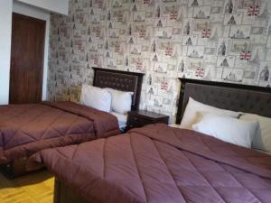 Ένα ή περισσότερα κρεβάτια σε δωμάτιο στο Castle Hostel