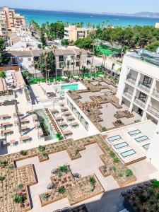 an aerial view of a city with buildings and the ocean at Hotel Paradiso Garden in Playa de Palma