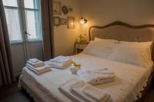 Łóżko lub łóżka w pokoju w obiekcie Kyria Boutique House