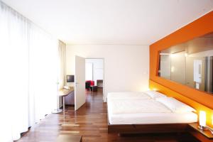 Postel nebo postele na pokoji v ubytování Spa Hotel Bründl