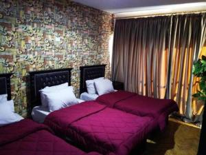 Ένα ή περισσότερα κρεβάτια σε δωμάτιο στο Castle Hostel