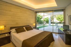 Ένα ή περισσότερα κρεβάτια σε δωμάτιο στο Villa Agusmar +40 φωτογραφίες