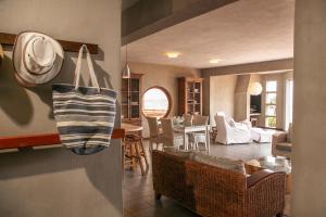 a kitchen and living room with a purse hanging from the wall at Blue Pearl - situated right on the beach in Swakopmund