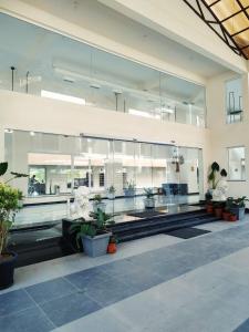 a large building with many windows and potted plants at Regenta Central North Goa, Arpora in Arpora +55 photos
