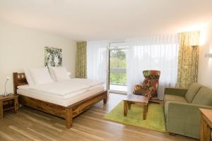 Postel nebo postele na pokoji v ubytování Hotel Sonnenhügel