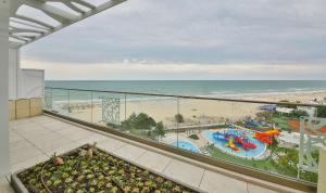 a view from a balcony of a beach with a view of the ocean at Maritim Paradise Blue Hotel & Spa in Albena