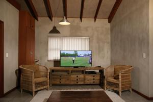 A television and/or entertainment centre at Blue Pearl - situated right on the beach