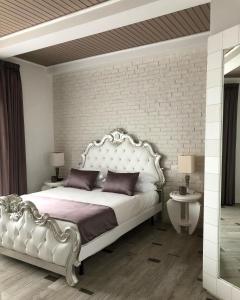 Postel nebo postele na pokoji v ubytování SuiteFrattini Private Spa