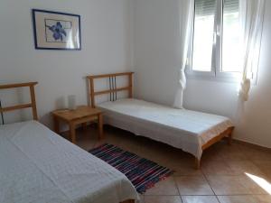 Postel nebo postele na pokoji v ubytování Villa Kos