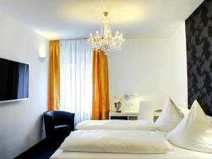 Postel nebo postele na pokoji v ubytování Hotel Linde