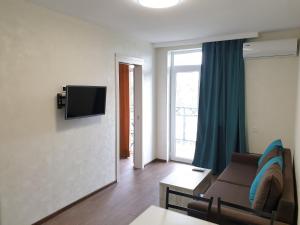 Телевизор и/или развлекательный центр в Apartment near the Beach Batumi-Gonio