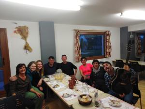 a group of people sitting around a table at Albergue Irugoienea in Espinal-Auzperri