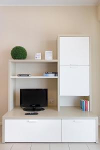 Telewizja i/lub zestaw kina domowego w obiekcie City Residence