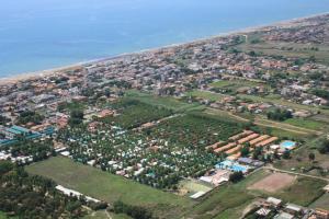 an aerial view of a city next to the ocean at Camping Village Nice Garden in Ardea