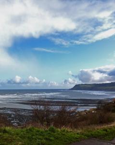 a view of the ocean on a cloudy day at Aldersyde Bed & Breakfast in Robin Hood's Bay