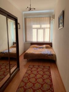 מיטה או מיטות בחדר ב-Apartment Niyazi 5