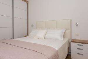 Postel nebo postele na pokoji v ubytování Penthouse Jure
