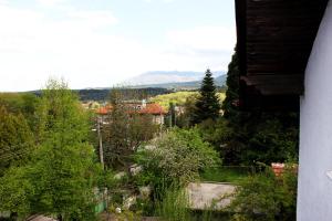 a view of a town with trees and buildings at Bankya Guest House - Sofia in Bankya