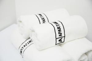 a pile of towels with the words thank you written on them at Apartament Champion in Gorzów Wielkopolski +9 photos